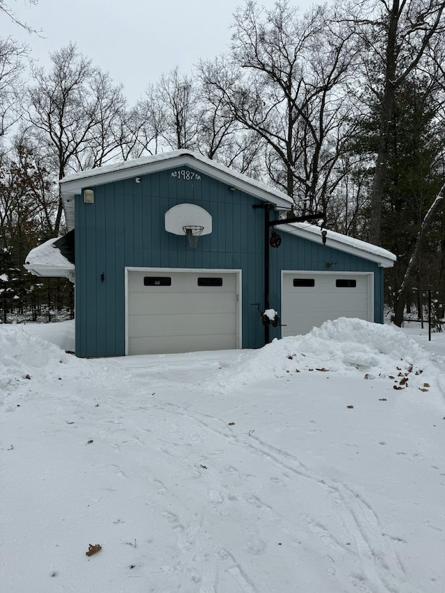 view of snow covered garage