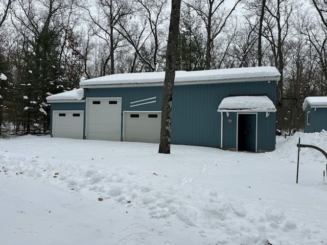 view of snow covered garage