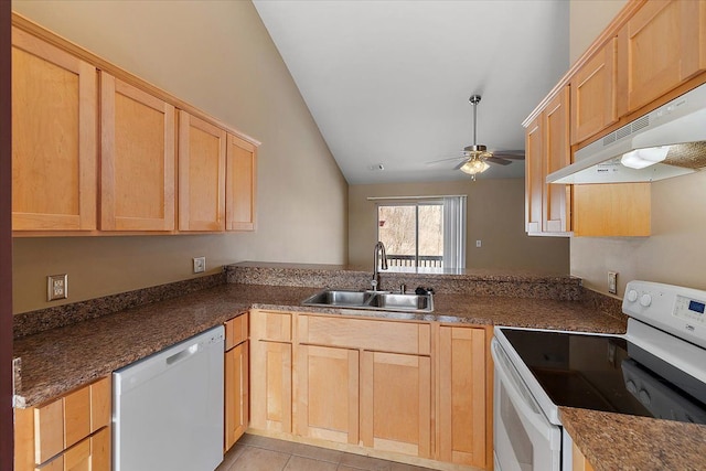 kitchen with lofted ceiling, sink, white appliances, ceiling fan, and kitchen peninsula