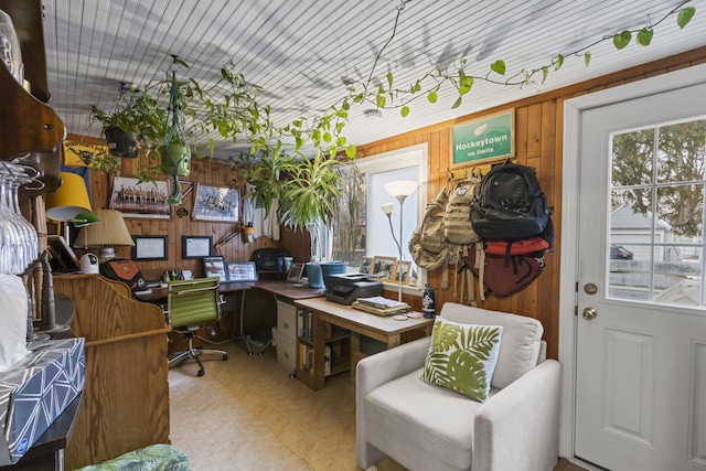 home office featuring wood walls