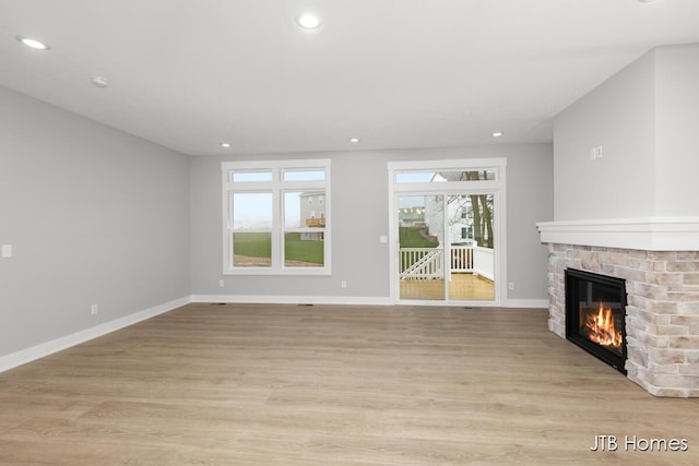 unfurnished living room featuring light hardwood / wood-style flooring