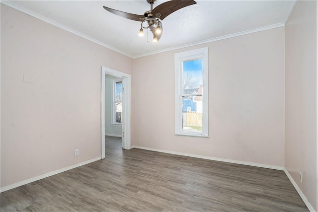 unfurnished room with hardwood / wood-style flooring, crown molding, and ceiling fan