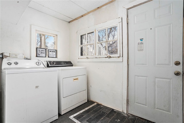 clothes washing area featuring separate washer and dryer