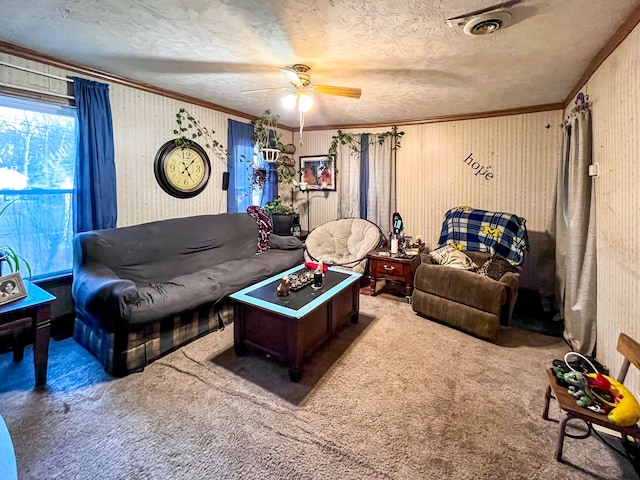 carpeted living room featuring ornamental molding, ceiling fan, and a textured ceiling