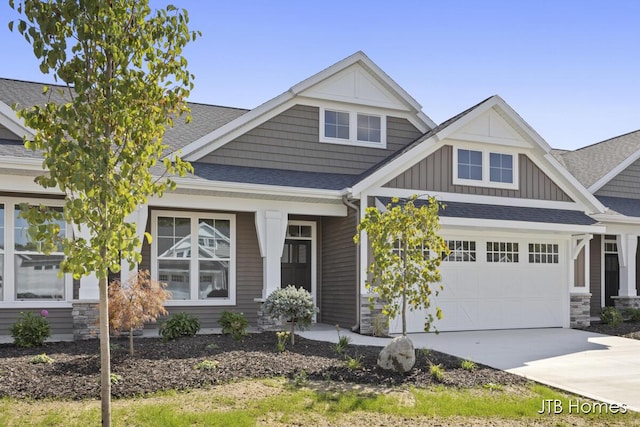 craftsman house with a garage