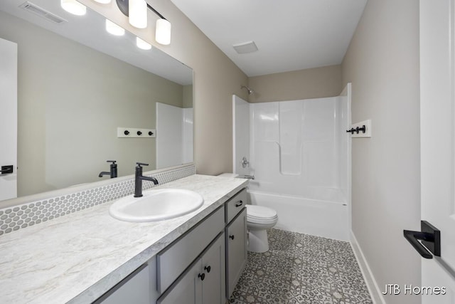 full bathroom featuring vanity, toilet, and shower / washtub combination