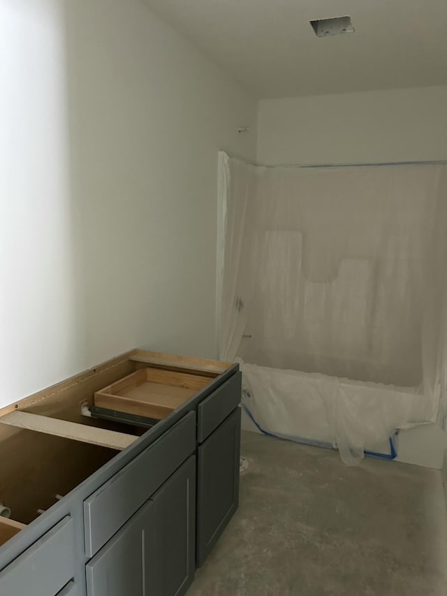 bathroom with vanity and concrete flooring