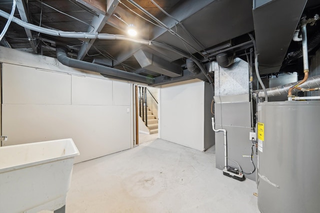 basement featuring water heater and sink