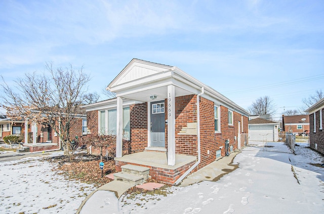 view of front of home featuring a garage and an outdoor structure