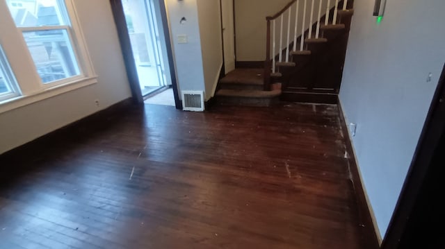 entrance foyer with dark hardwood / wood-style flooring