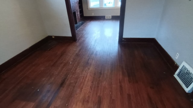 unfurnished room featuring dark hardwood / wood-style floors