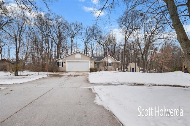 view of snowy exterior featuring a garage