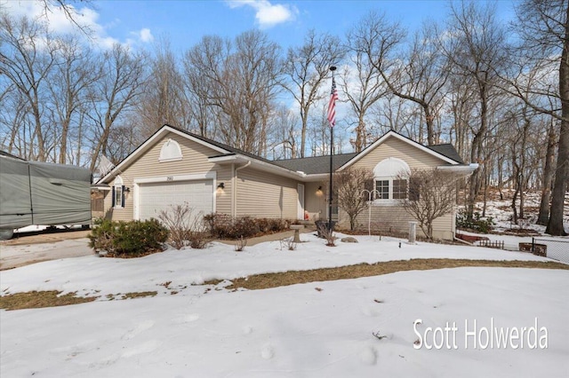 single story home featuring a garage