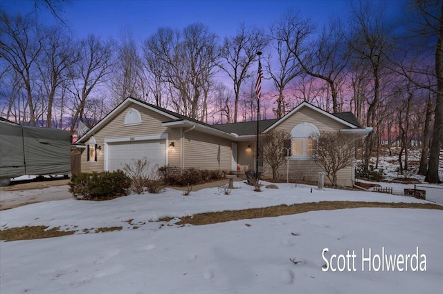 single story home featuring a garage