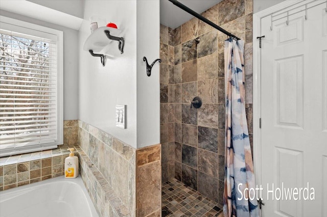 bathroom featuring separate shower and tub