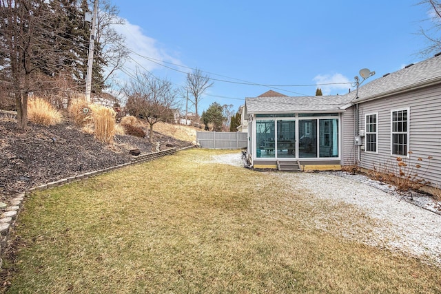 view of yard with a sunroom