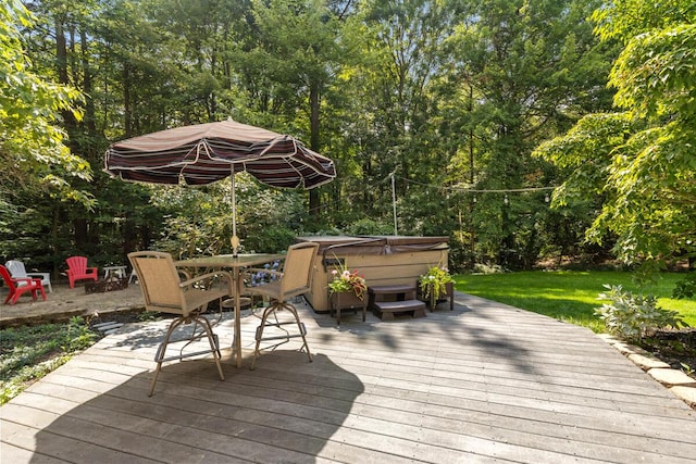 wooden deck with a hot tub