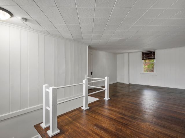 basement with dark wood-type flooring