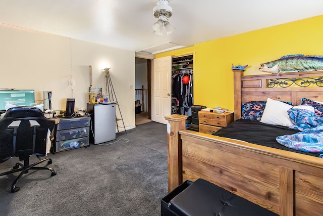 carpeted bedroom featuring fridge and a closet