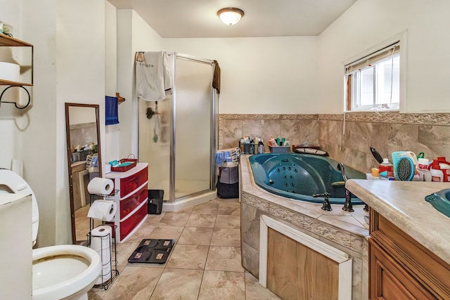 bathroom featuring vanity, toilet, a shower with shower door, and tile patterned flooring