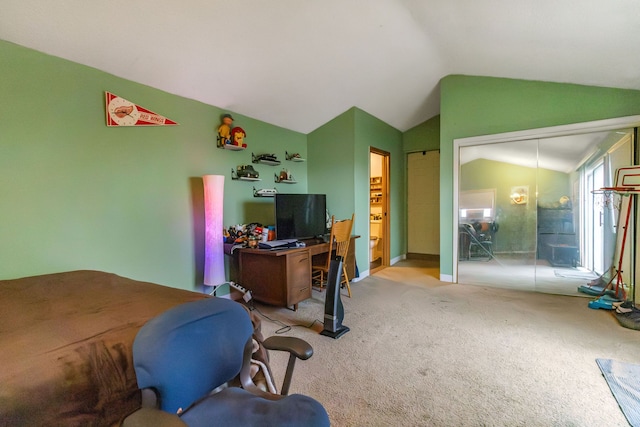 carpeted bedroom with lofted ceiling