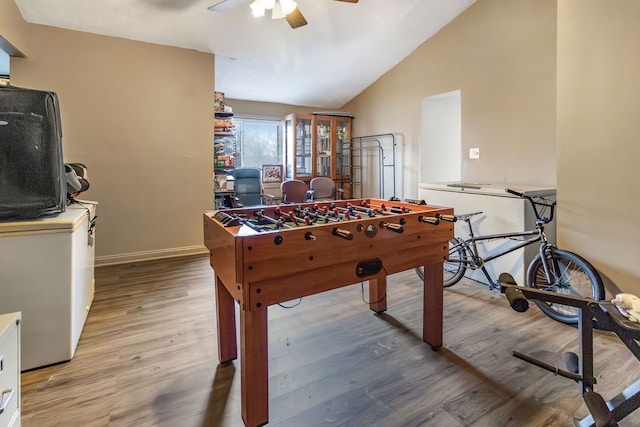 game room featuring vaulted ceiling, wood-type flooring, and ceiling fan