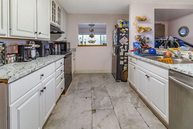 kitchen featuring white cabinetry, sink, black refrigerator, and dishwasher