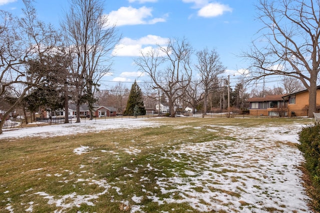 view of yard layered in snow