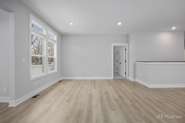 unfurnished living room featuring light wood-type flooring