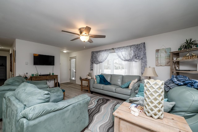 living room with hardwood / wood-style floors and ceiling fan