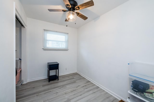 unfurnished bedroom featuring ceiling fan, light hardwood / wood-style floors, and a closet