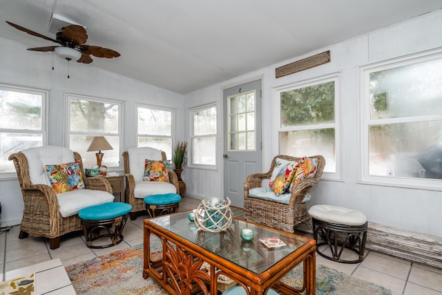 sunroom with lofted ceiling and ceiling fan