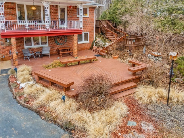 back of house with brick siding