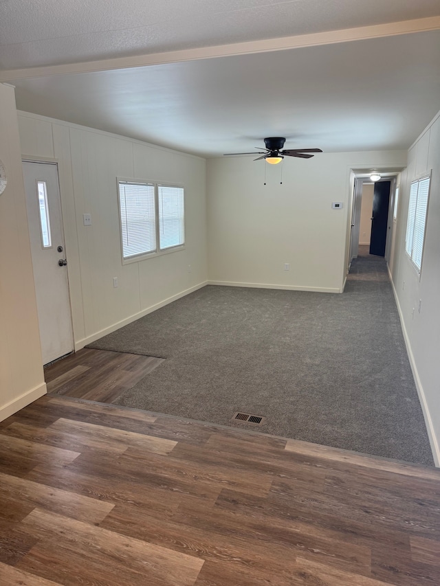 interior space featuring dark hardwood / wood-style floors and ceiling fan