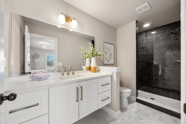 bathroom with a walk in shower, toilet, vanity, visible vents, and marble finish floor