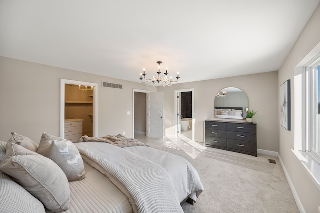 bedroom with a chandelier, light colored carpet, visible vents, and baseboards