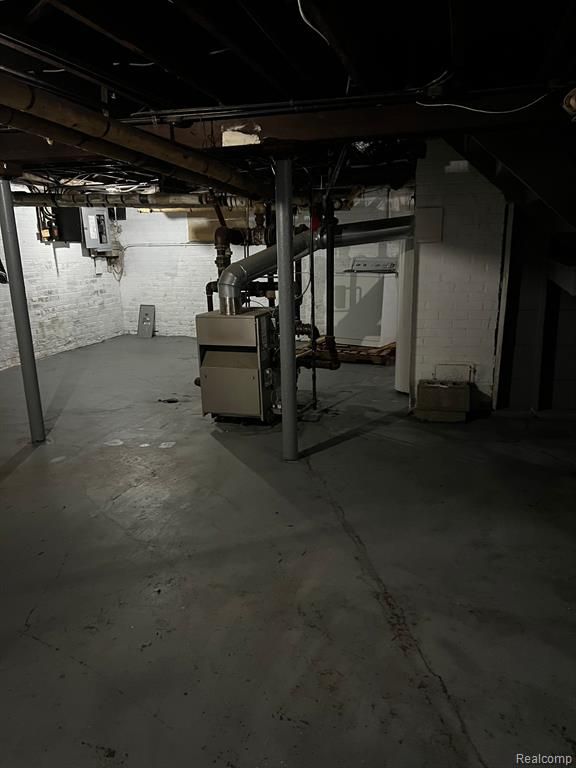 basement featuring electric panel