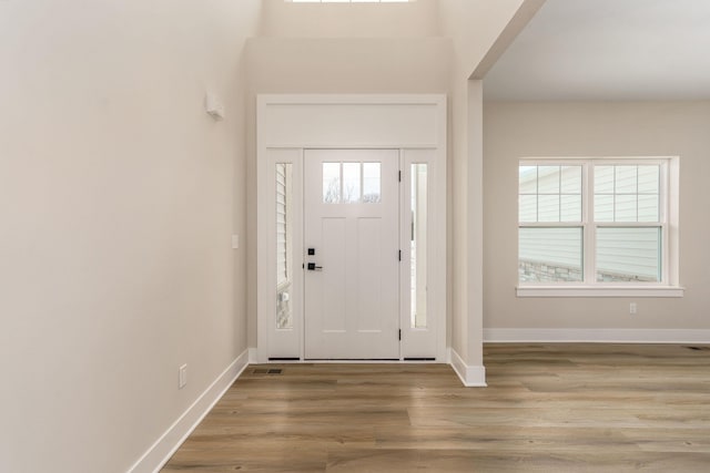 foyer entrance with light wood-type flooring