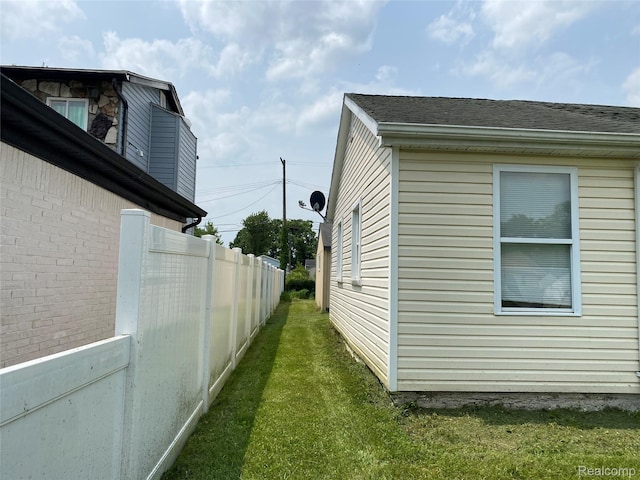 58785 Chennault Dr, New Haven, MI 48048 - view of side of property with a shingled roof