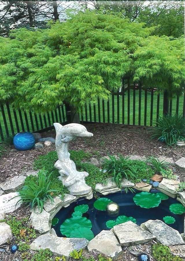 exterior details featuring a small pond