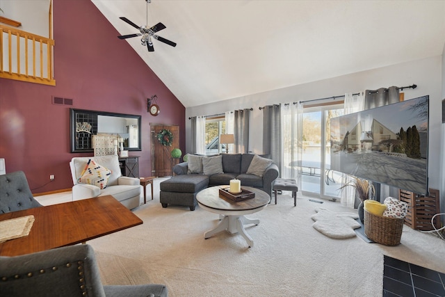 living room featuring ceiling fan, high vaulted ceiling, and carpet