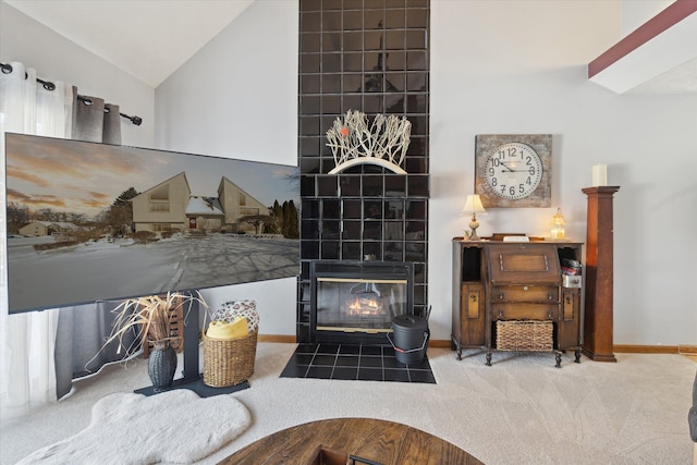 interior details featuring carpet flooring and a tiled fireplace