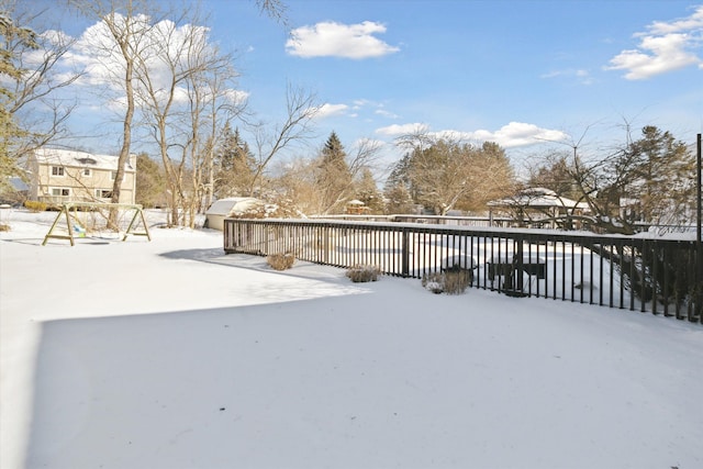 view of yard covered in snow