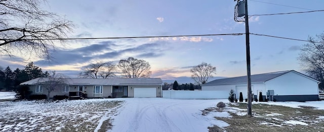 single story home with a garage