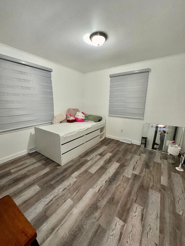 bedroom featuring dark wood-type flooring