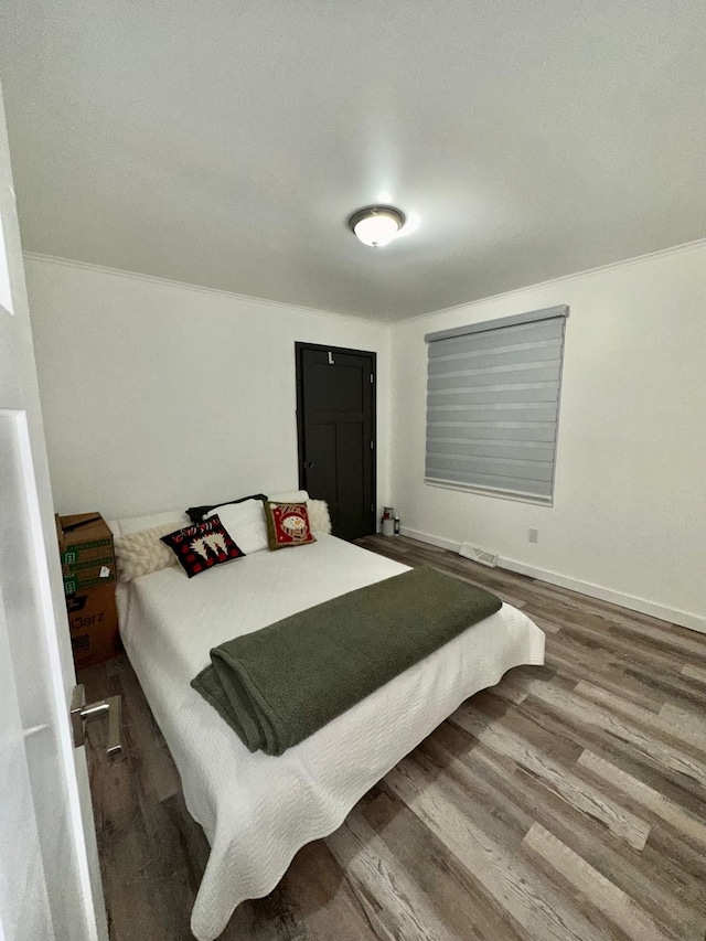 bedroom featuring hardwood / wood-style floors