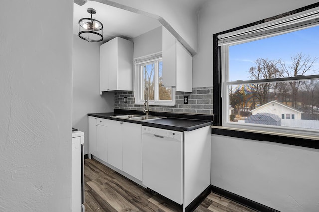 kitchen featuring sink, white appliances, dark wood-type flooring, white cabinets, and decorative backsplash