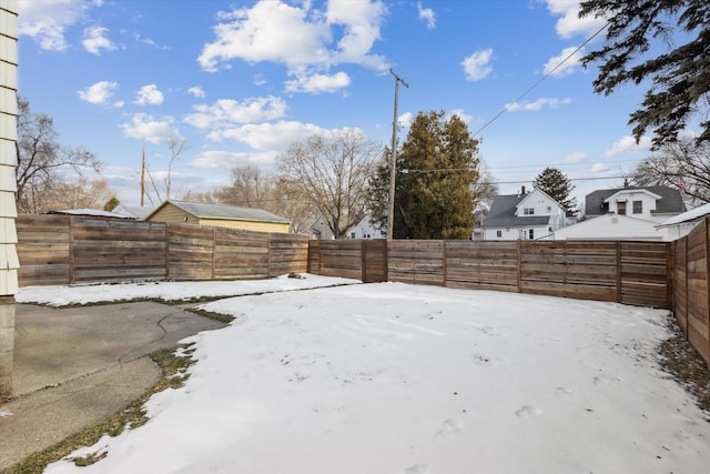 view of yard layered in snow