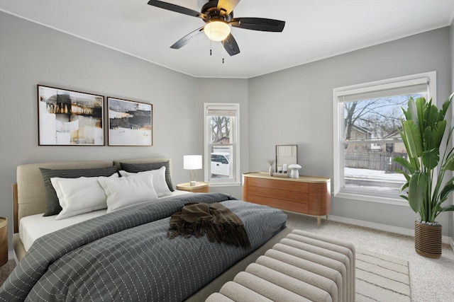 bedroom featuring ceiling fan and carpet