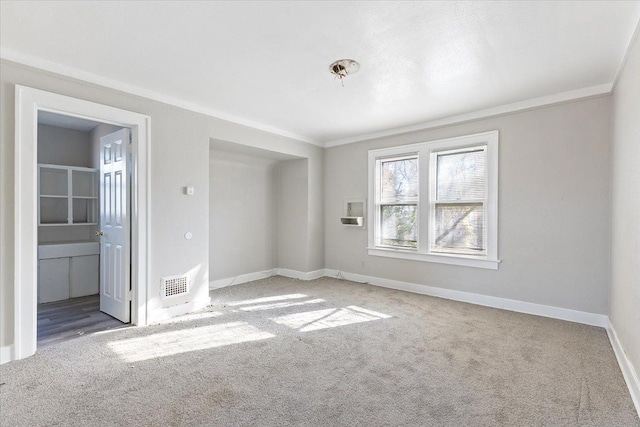 carpeted spare room with ornamental molding